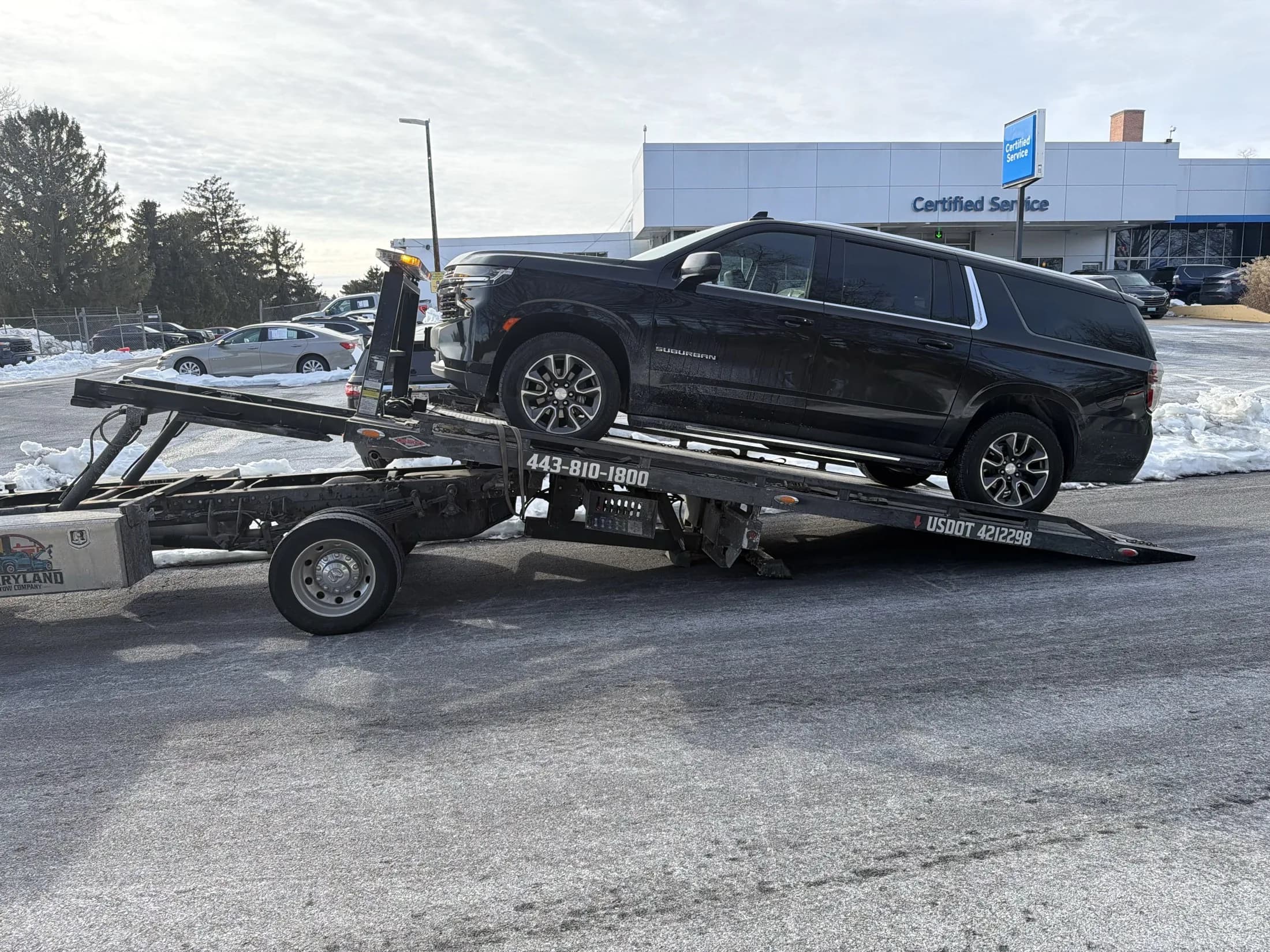SUV being loaded onto a Maryland Tow Company flatbed